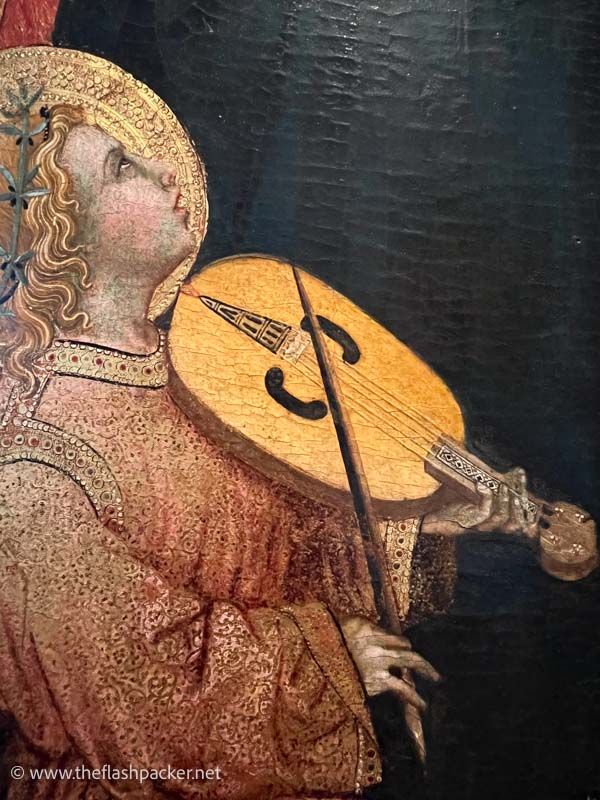 painting of an angel playing a violin