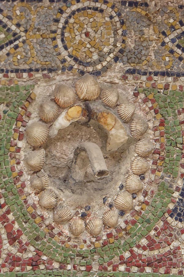 roman mosaic and water spout