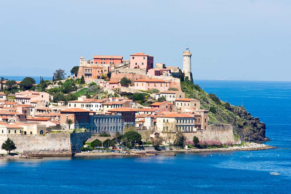 small town on a hillside by the ocean