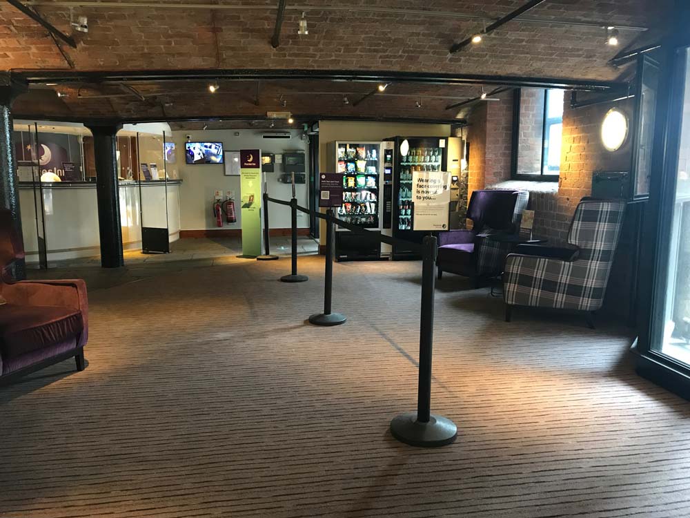 hotel reception area with chairs and reception desk