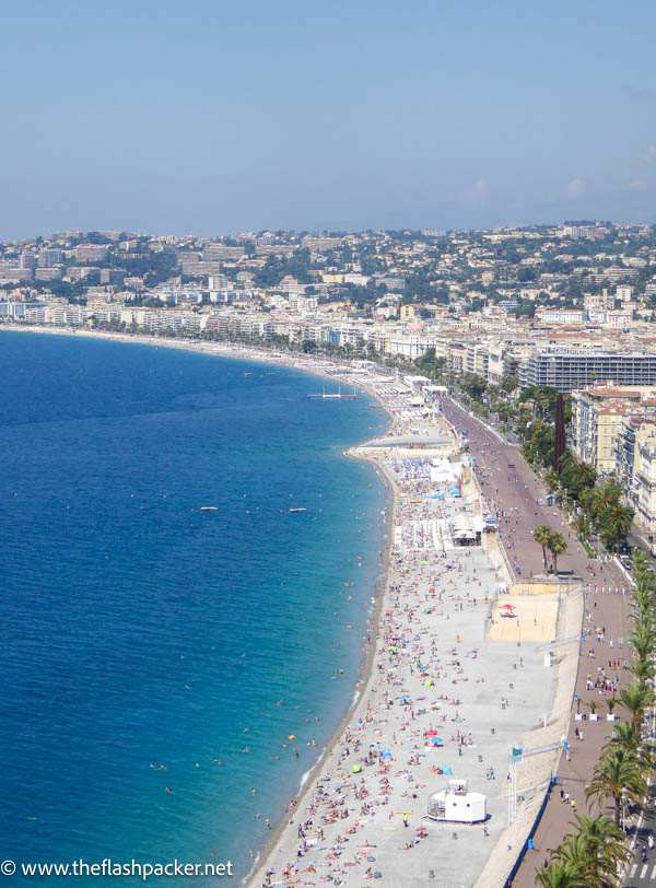 aerial view of a long beach backed by buildings