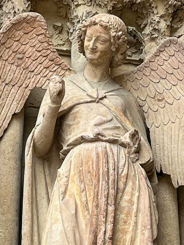 stone statue of a smiling angel