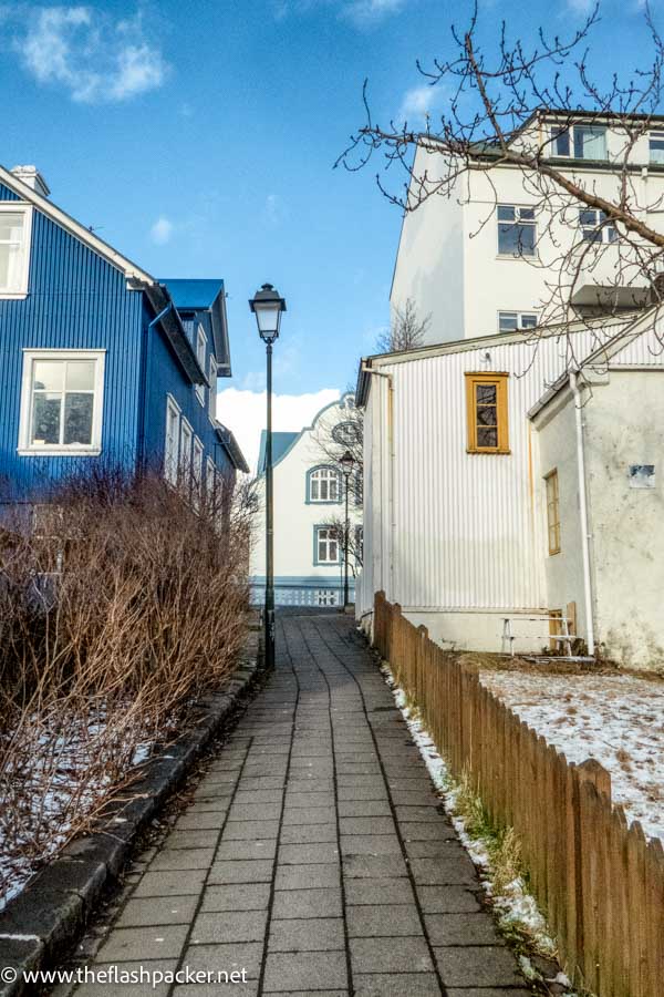 brightly coloured wooden houses on cobbled street in old west side in reykjavik