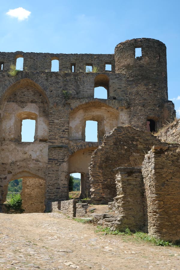 ruins of a castle with tower and opening where windows were