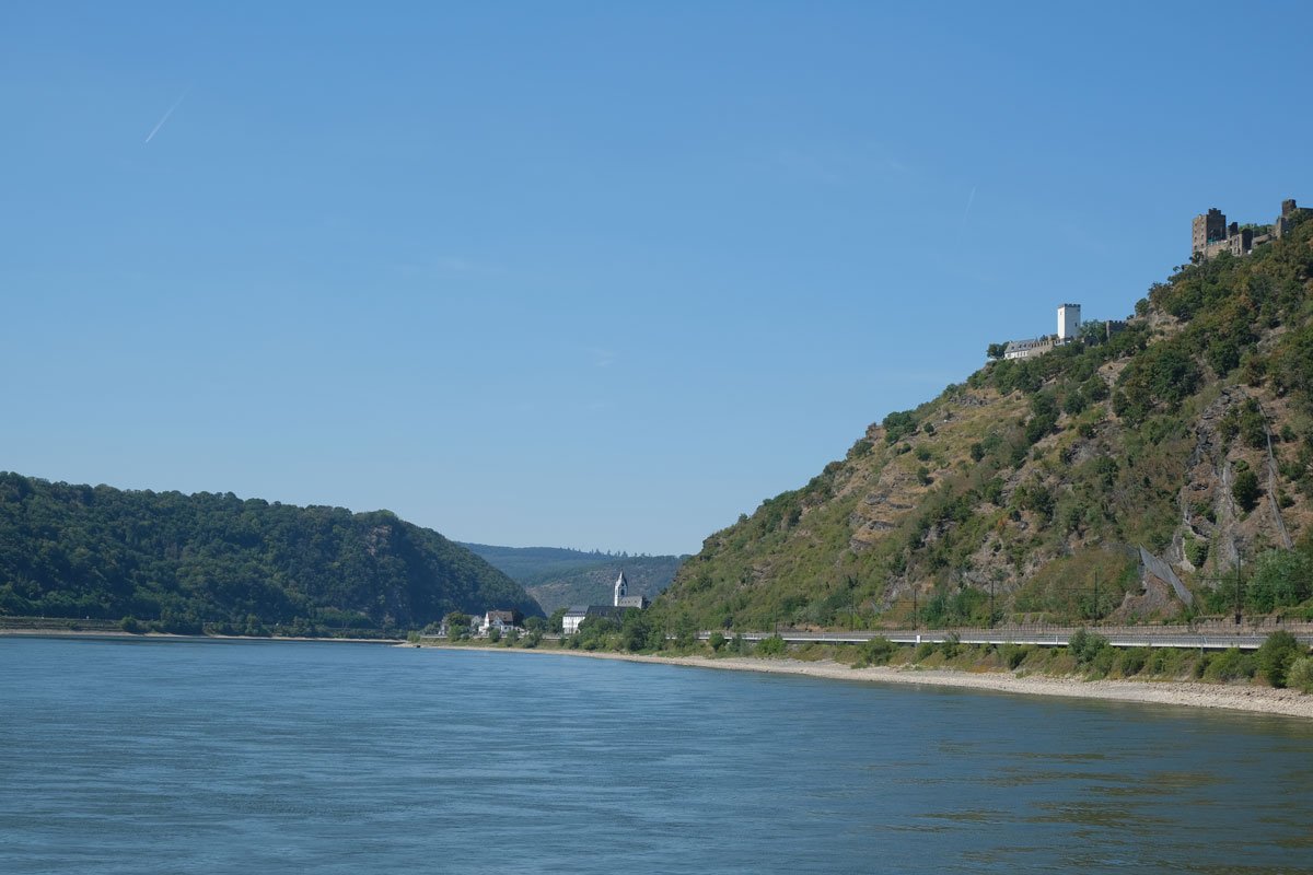 the rhine river in germany with a castle on the hillside