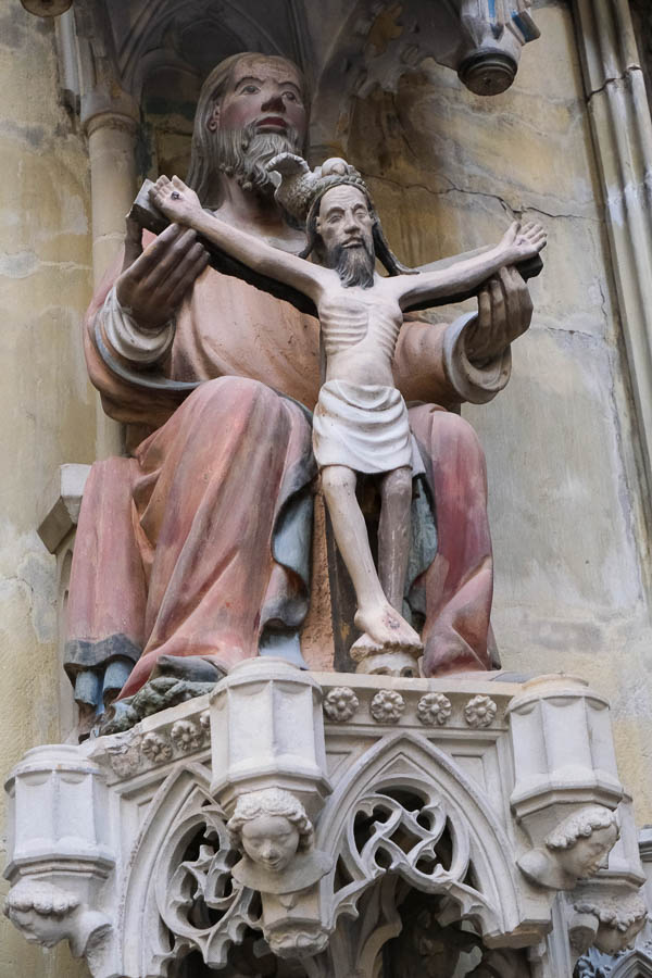 stone sculpture of jesus and god