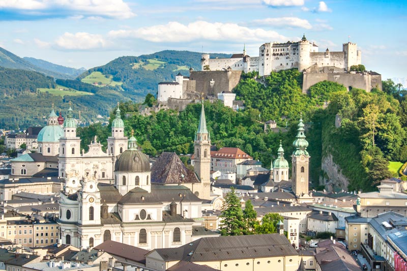 the rooftops and spires of the city of salzburg