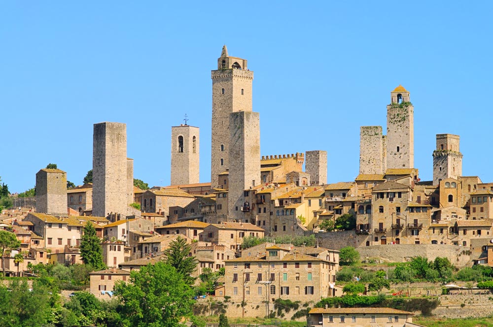 warm stone medieval towers of san gimignano in tuscany italy