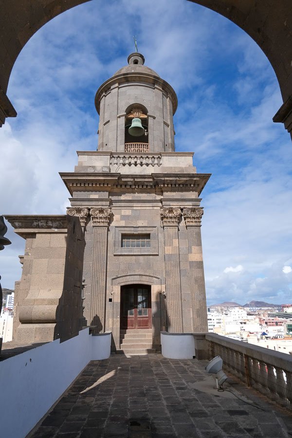 bell tower of santa ana catherdal in gran canaria viewed through an arch