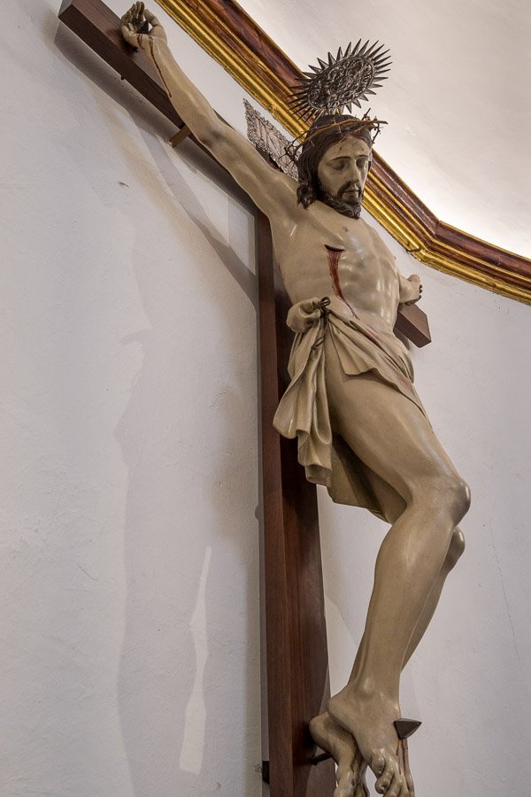 wooden sculpture of jesus on the cross