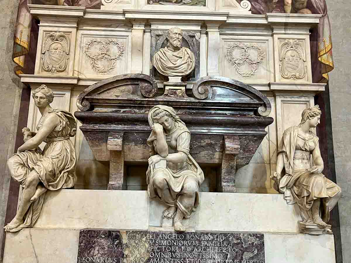 tomb of michelangelo in florence with three sculptural figures