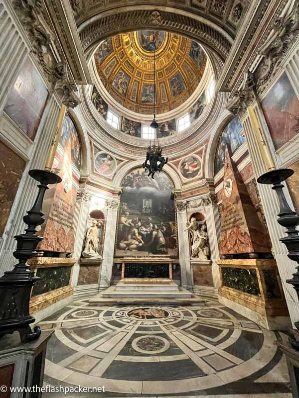 beautiful side chapel in church with small dome and marble floor