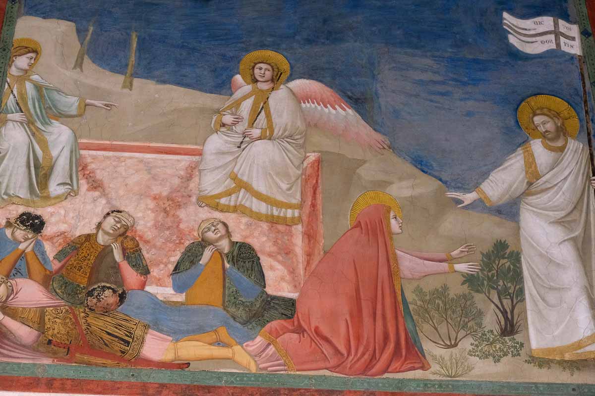 fresco by giotto of the risen jesus approached by mary in a red cloak