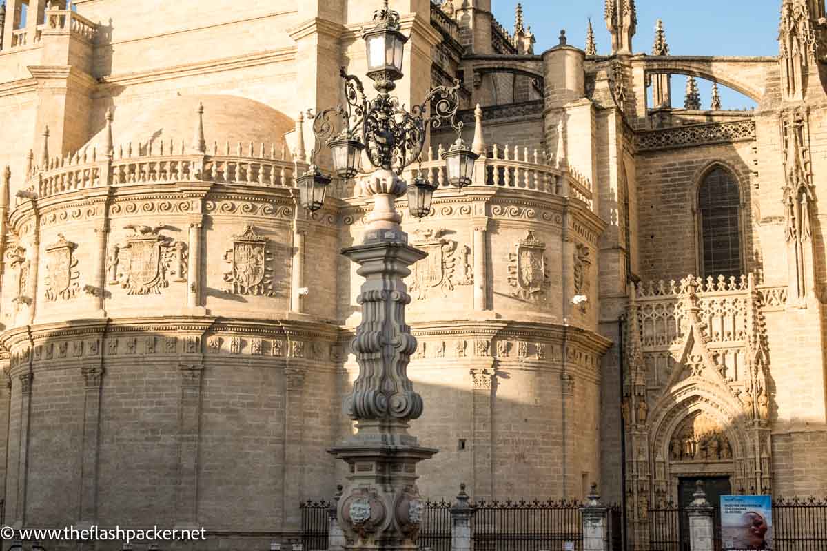 carved honey hued stonework on outside of cathedral of seville