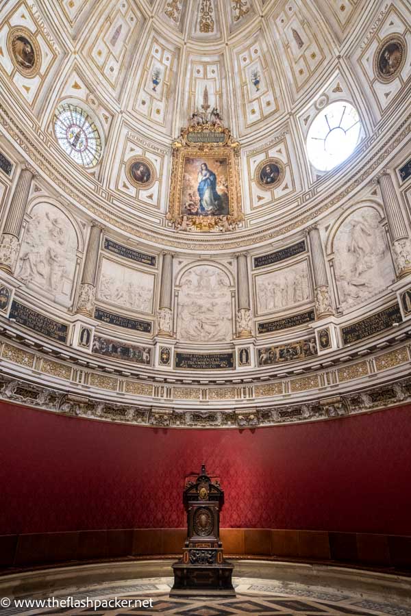 room with elaborate domed ceiling with painting of virgin mary