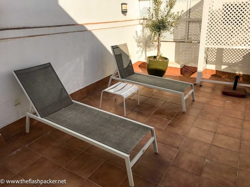 two sun loungers on a terrace