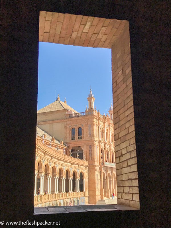 curving colonnade of vast plaza viewed through gateway