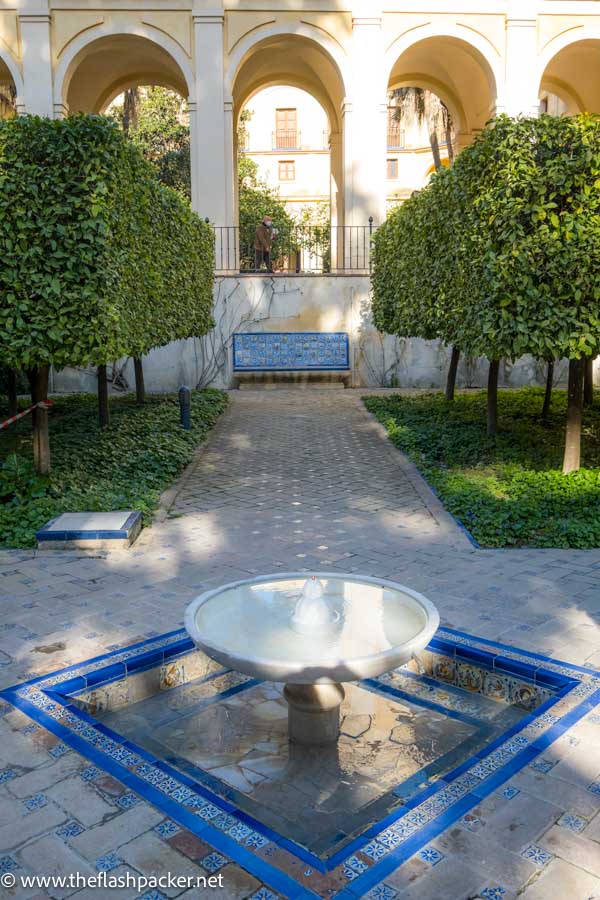 garden courtyard with bench and small fountain