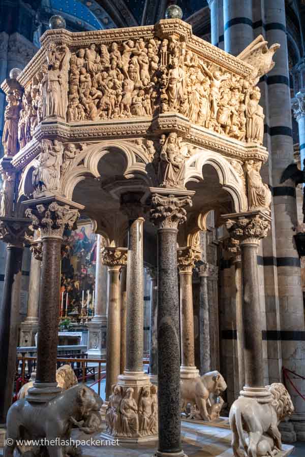 elaborately carved pulpit supported by slender marble columns