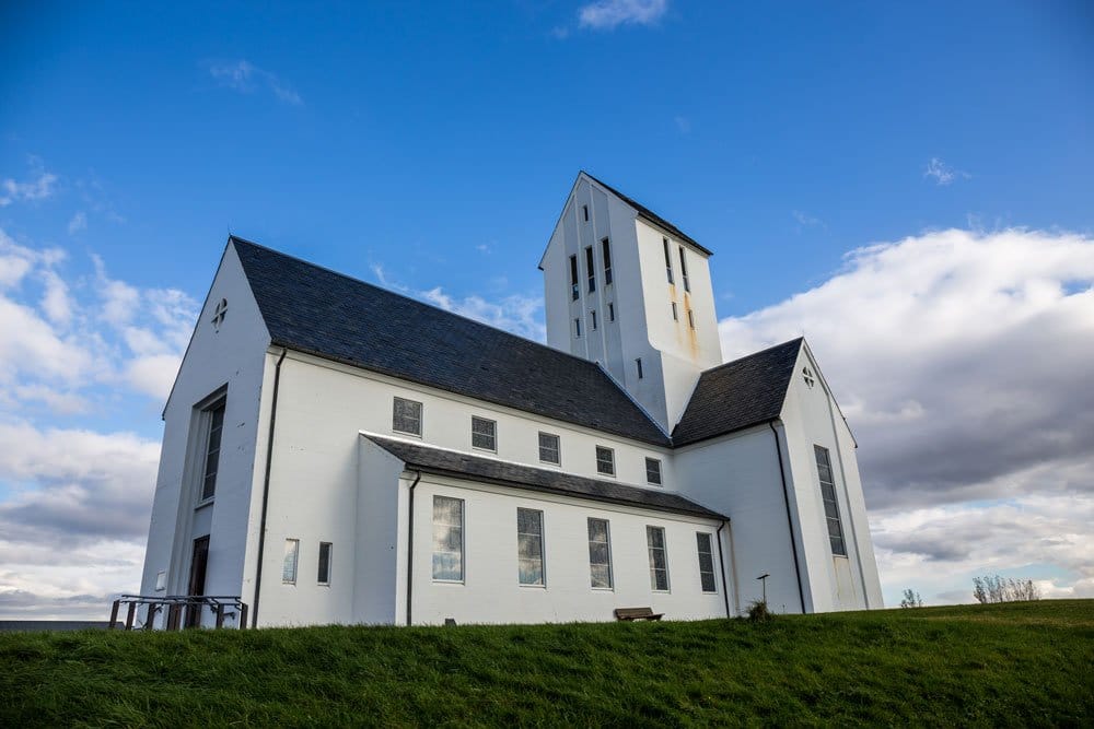 whitewashed church under a blue sky