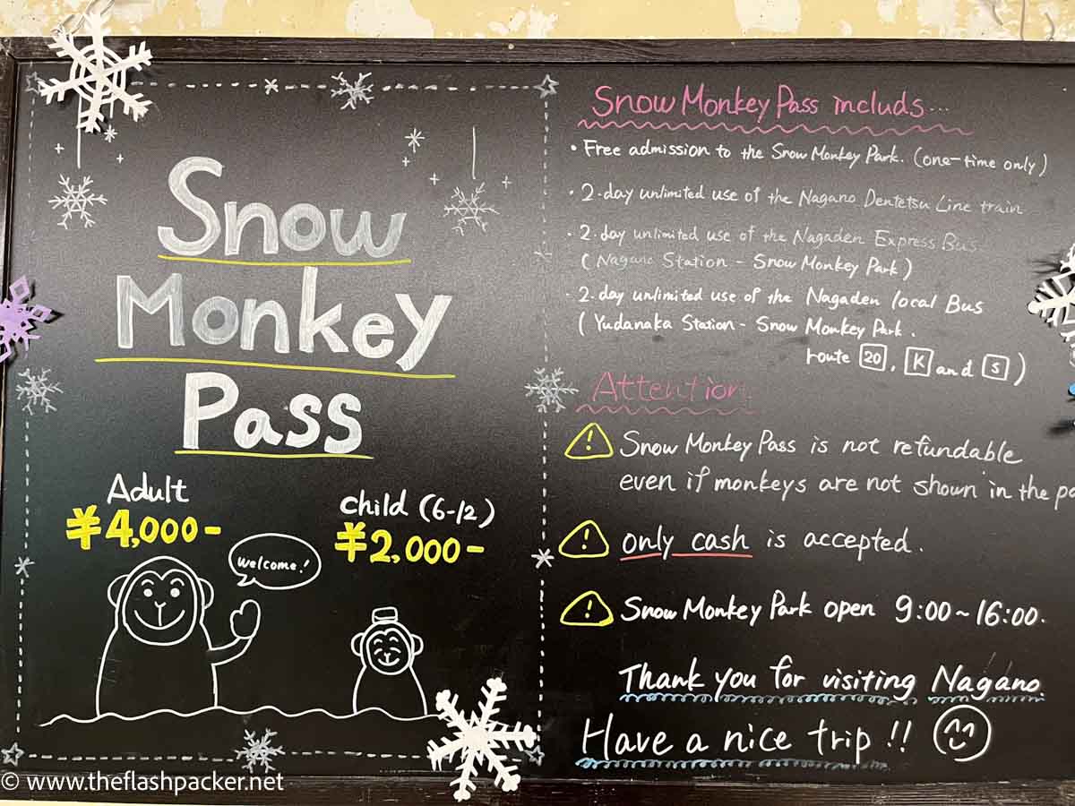 blackboard with information about snow monkey pass