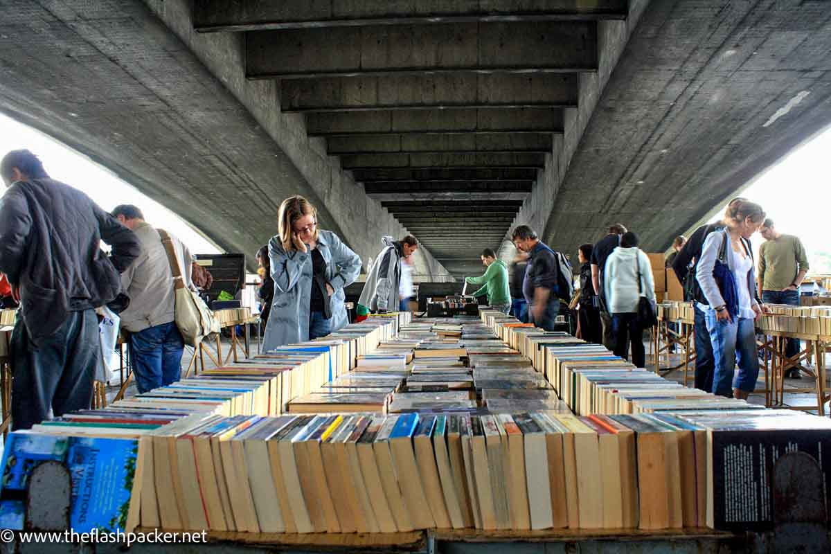 people browsing open air book stall