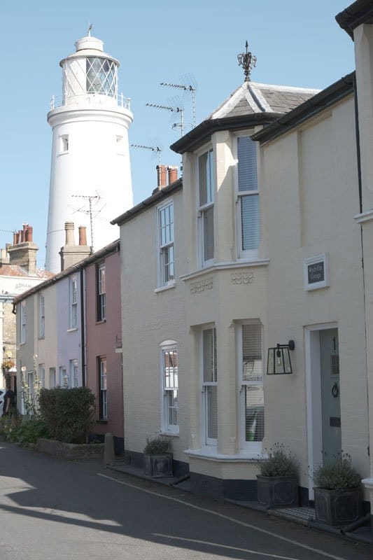 lighthouse-and-streets with pastel colored houses