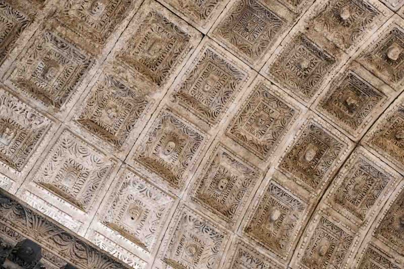 carved faces in ceiling of temple of jupiter split