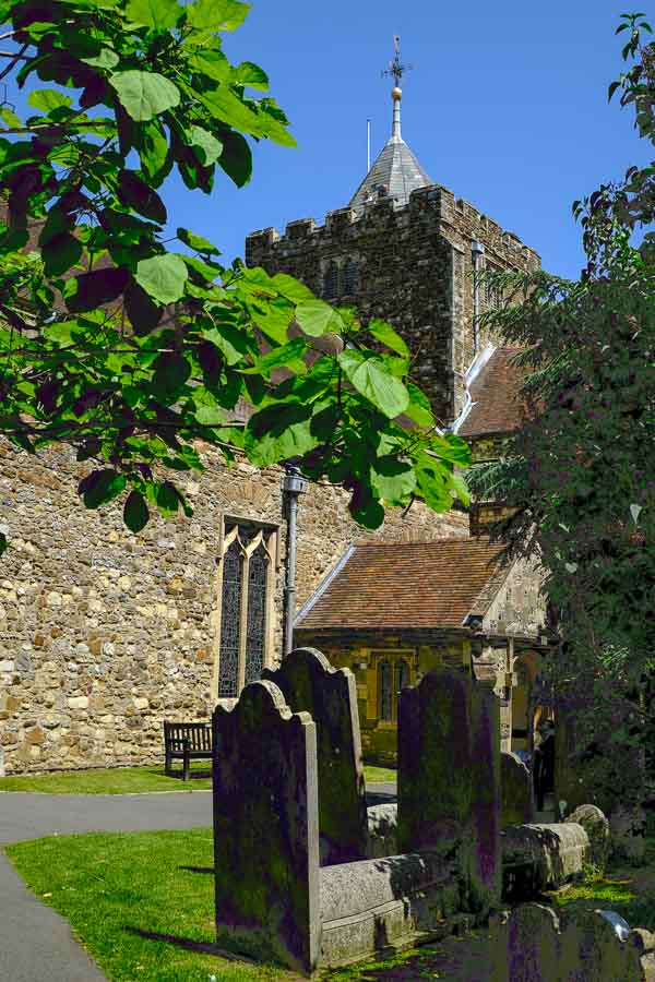 stone exterior of st marys church in rye and old graveyard