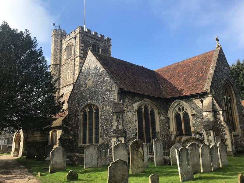 old churcd with tower and graveyard