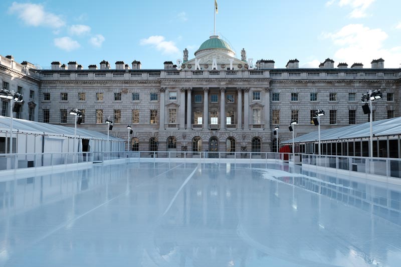 ice rink in front of majestic building of somerset house in london