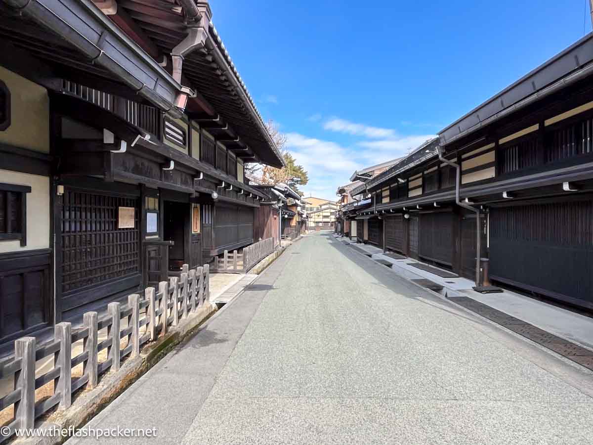 pretty street lined with traditional wooden japanese buildings