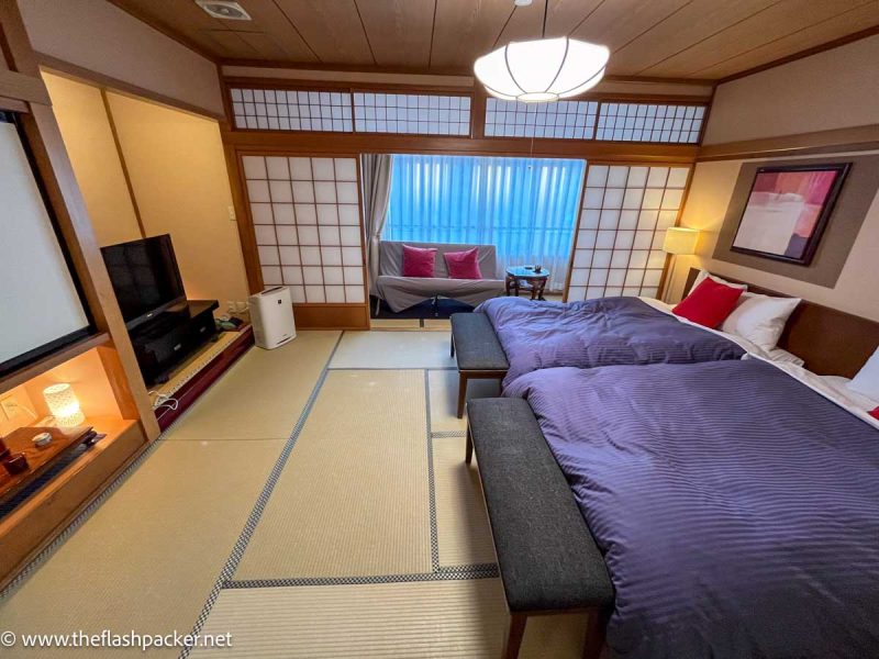 bedroom in Oyado Koto No Yume ryokan with 2 large beds and tatami floor