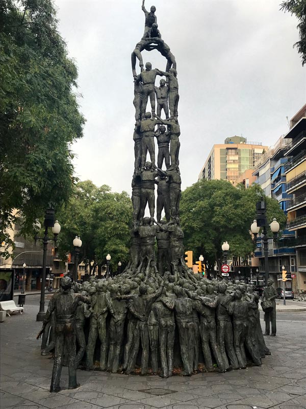 bronze sculpture of a tower of people