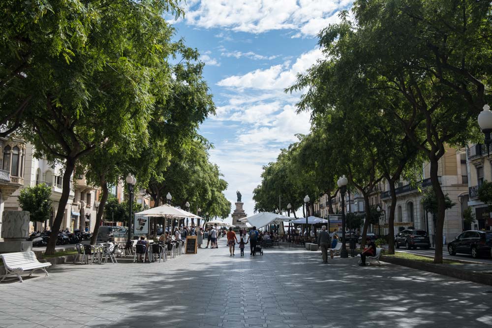 people walking along large pedestrianised street