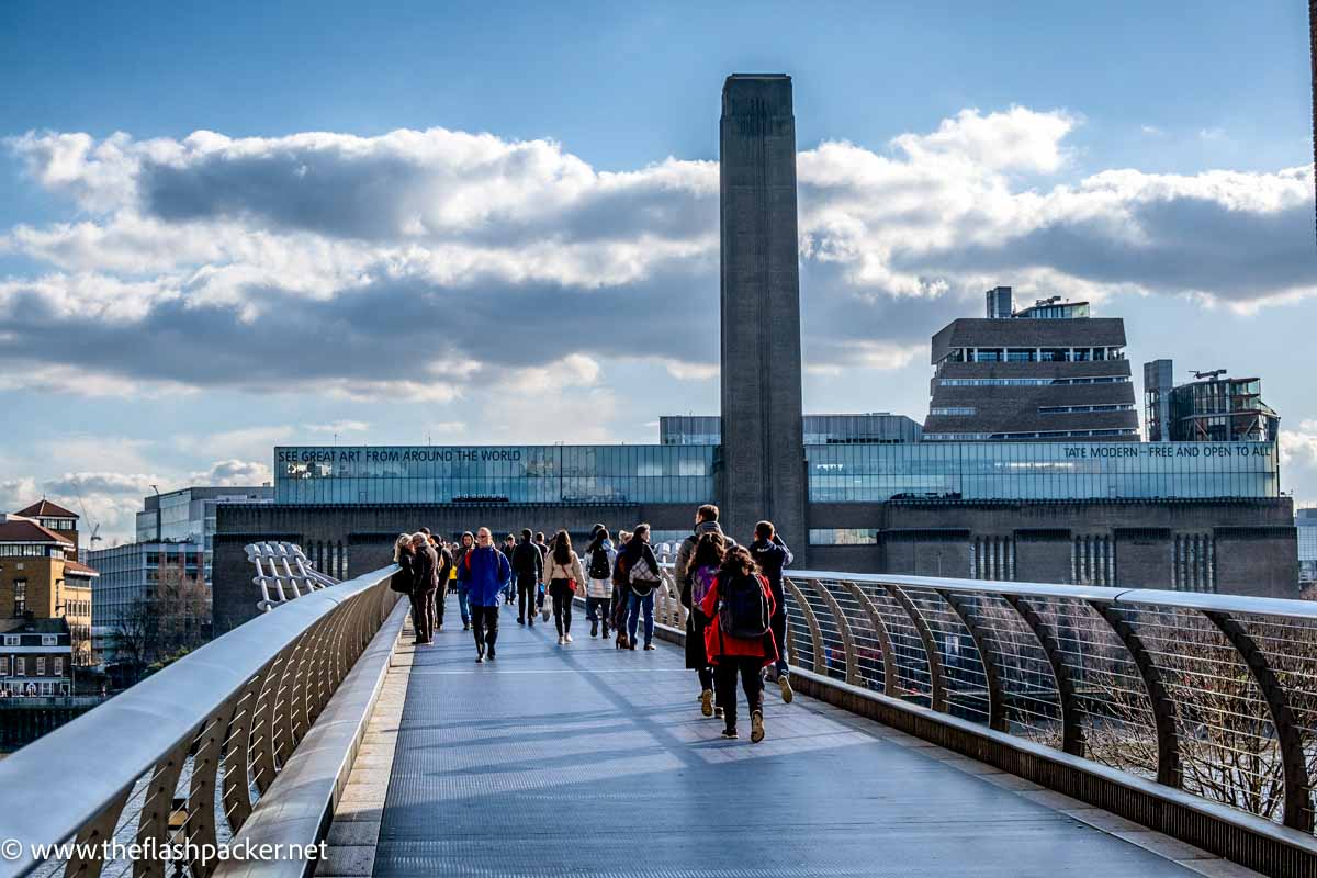 looking at the exterior of tate modern london from millennium bridge