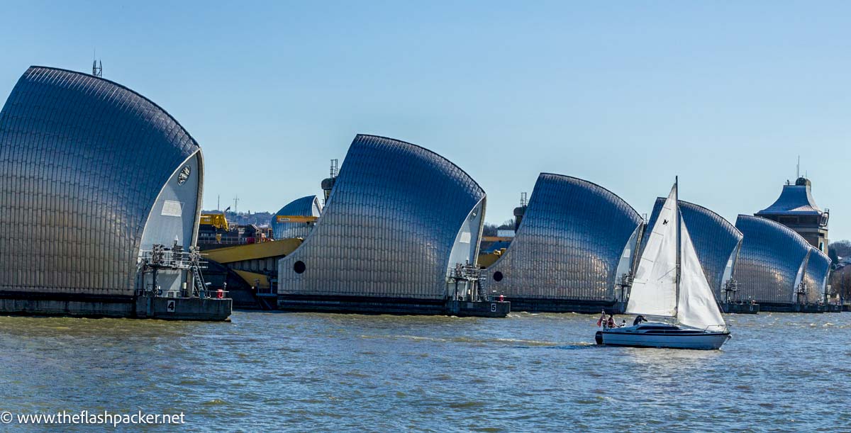 sailboat passing by the thames barrier london