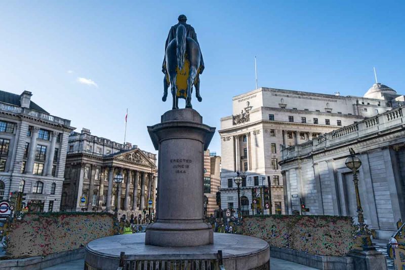 statue of soldier on horseback in the middle of the londons threadneedle street