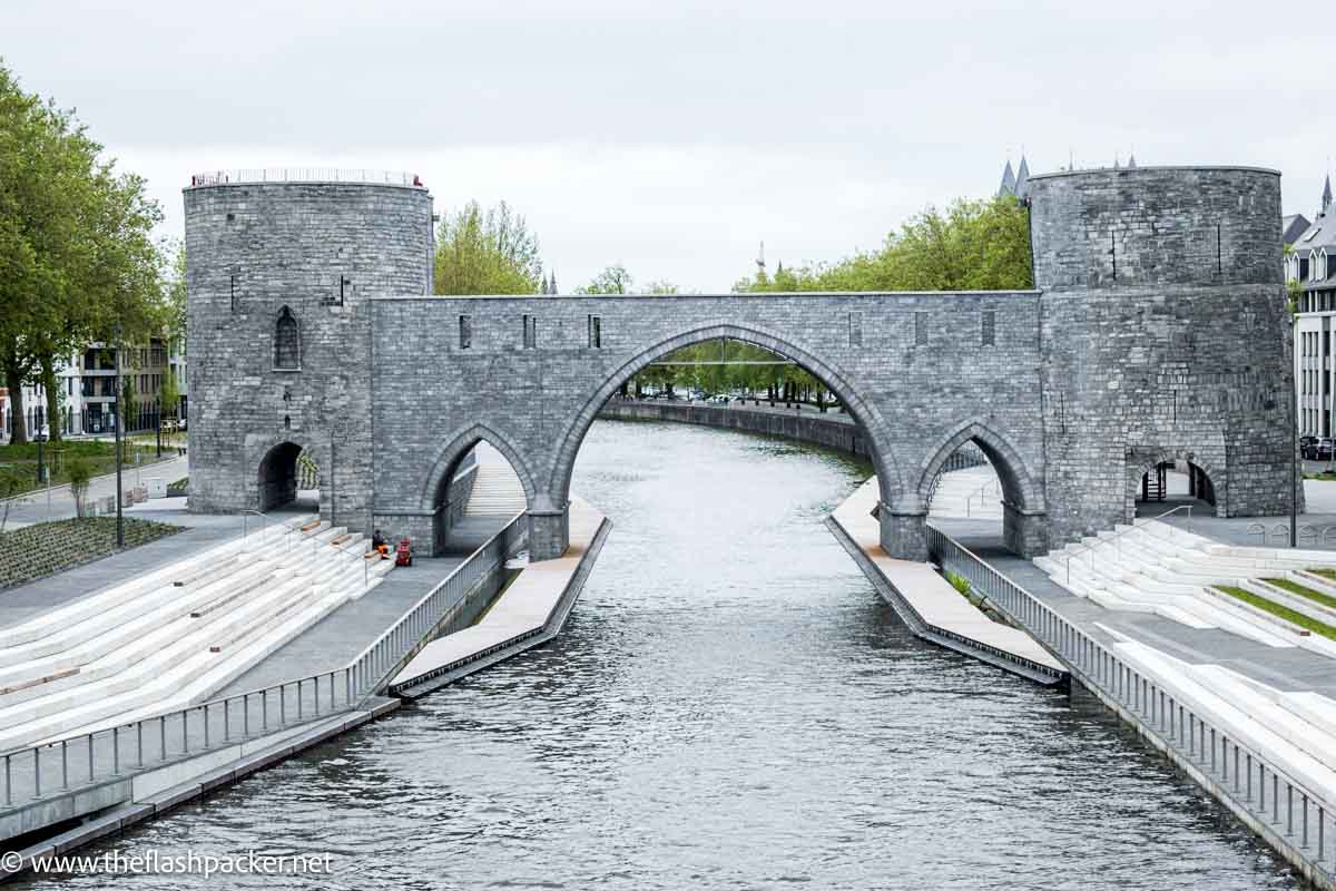 bridge over river with 3 arches and a round tower at either end