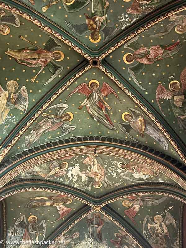 painted musician angels on vaulted ceiling of church