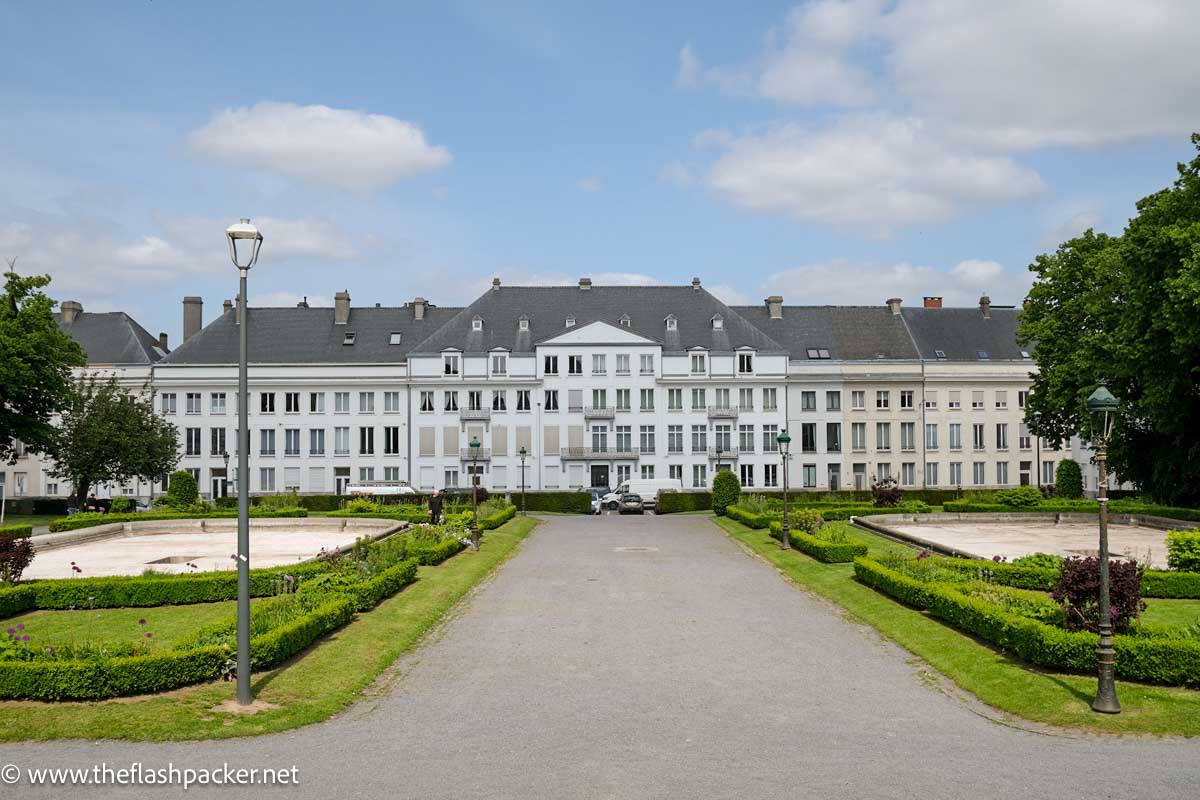 long frontage 3-storey white town hall building in tournai belgium