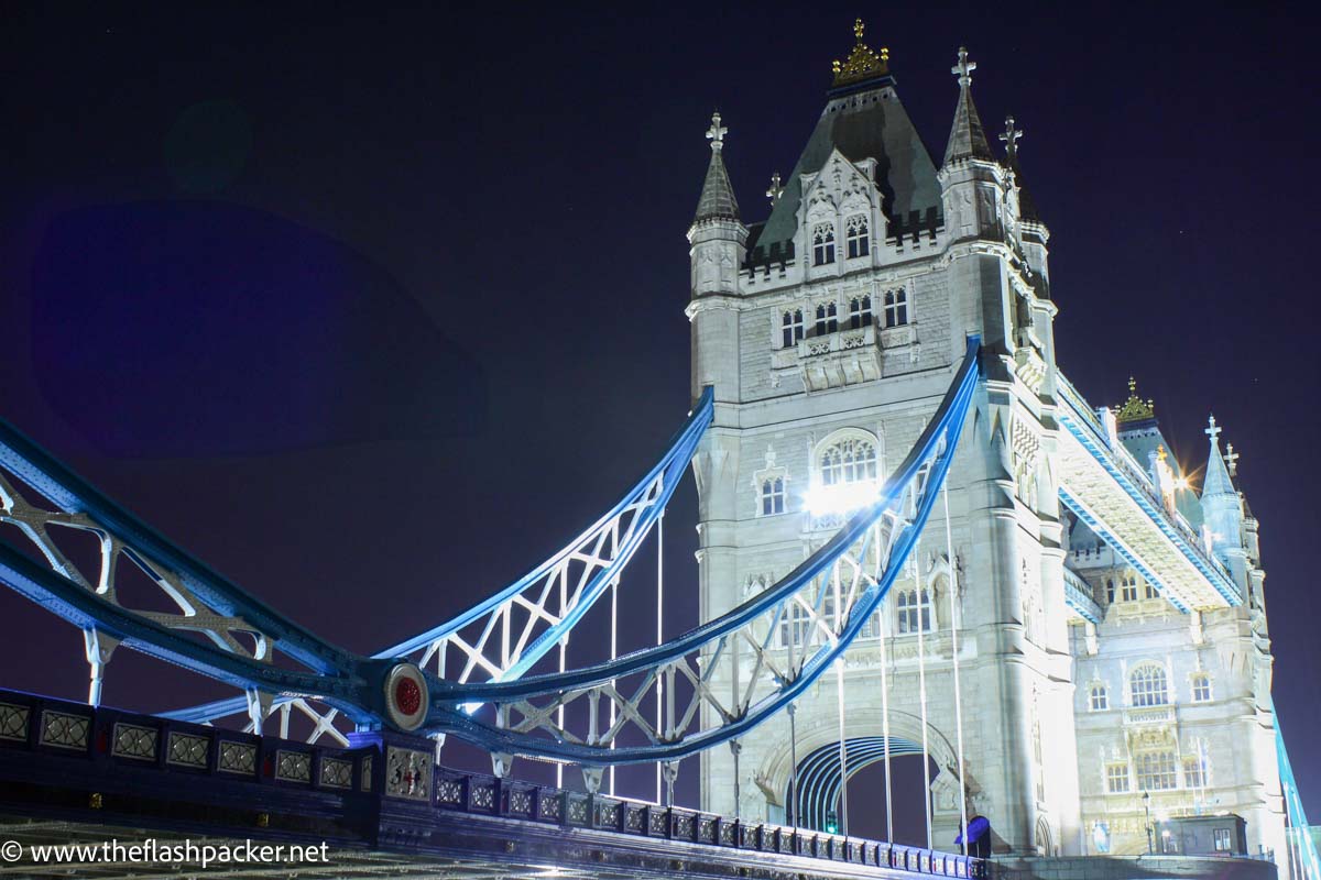 ornate tower bridge which is one of the most famous bridges in london lit up at night