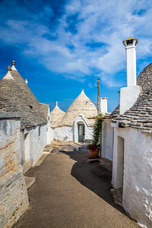 white conical shaped Trulli Houses in a street