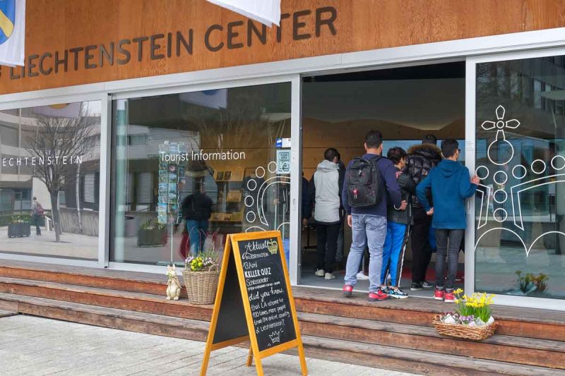 people queueing at liechtenstein tourist information centre