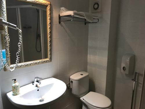 hotel bathroom with sink and toilet