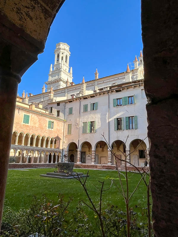 cloister of cathedral of verona with bell tower in view