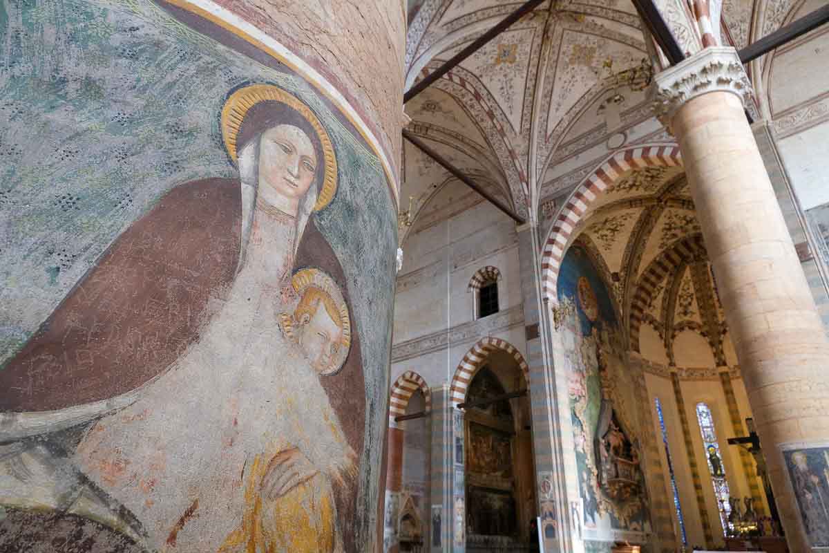 faded frescoed pillar in the church of saint anastasia in verona