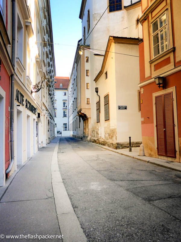 narrow street lined with old buildings in vienna