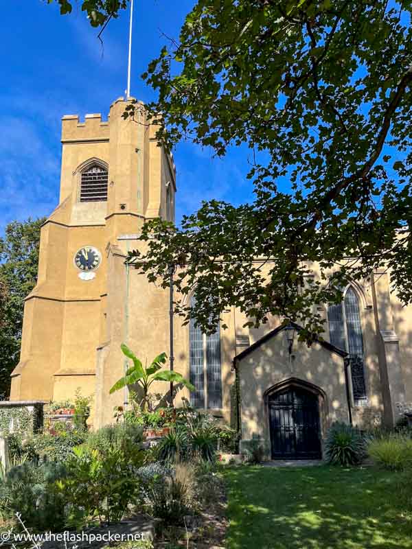 old warm stone church with bell tower