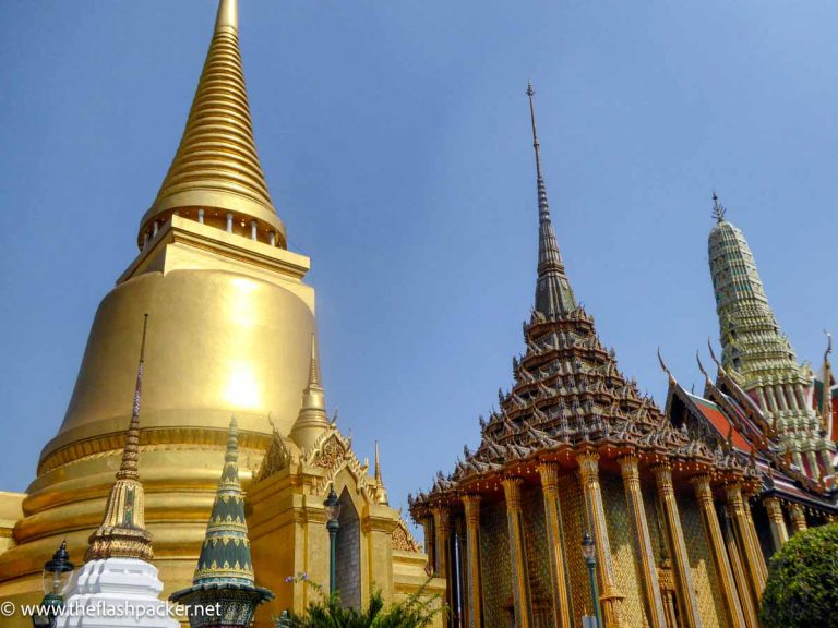 gold and stone tops of temple buildings seen on diy bangkok boat tour